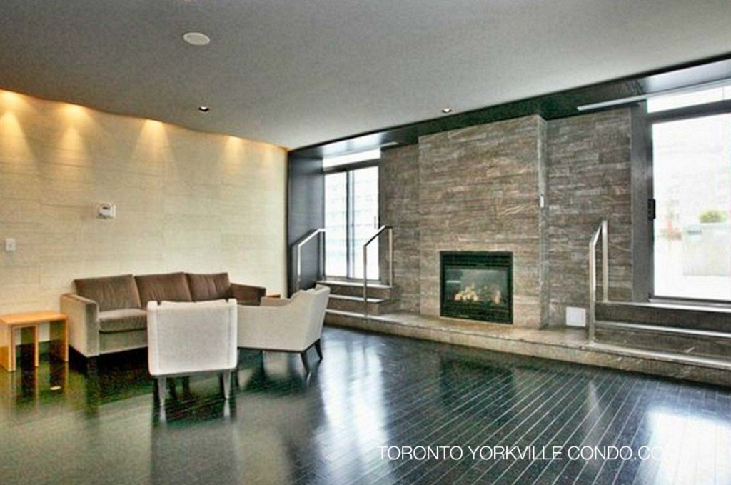 Walkout to rooftop terrace from common room with fireplace at 18 Yorkville