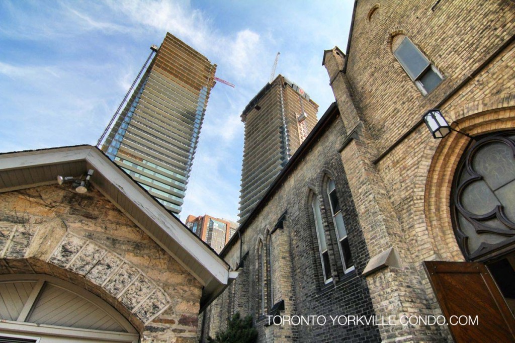 65 St Mary St and 1080 Bay St rising behind St Basil's Church